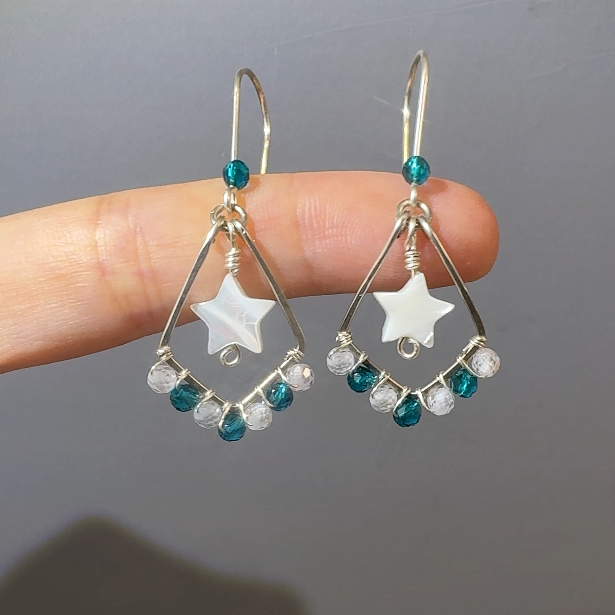 Silver-tone star earrings front detail
