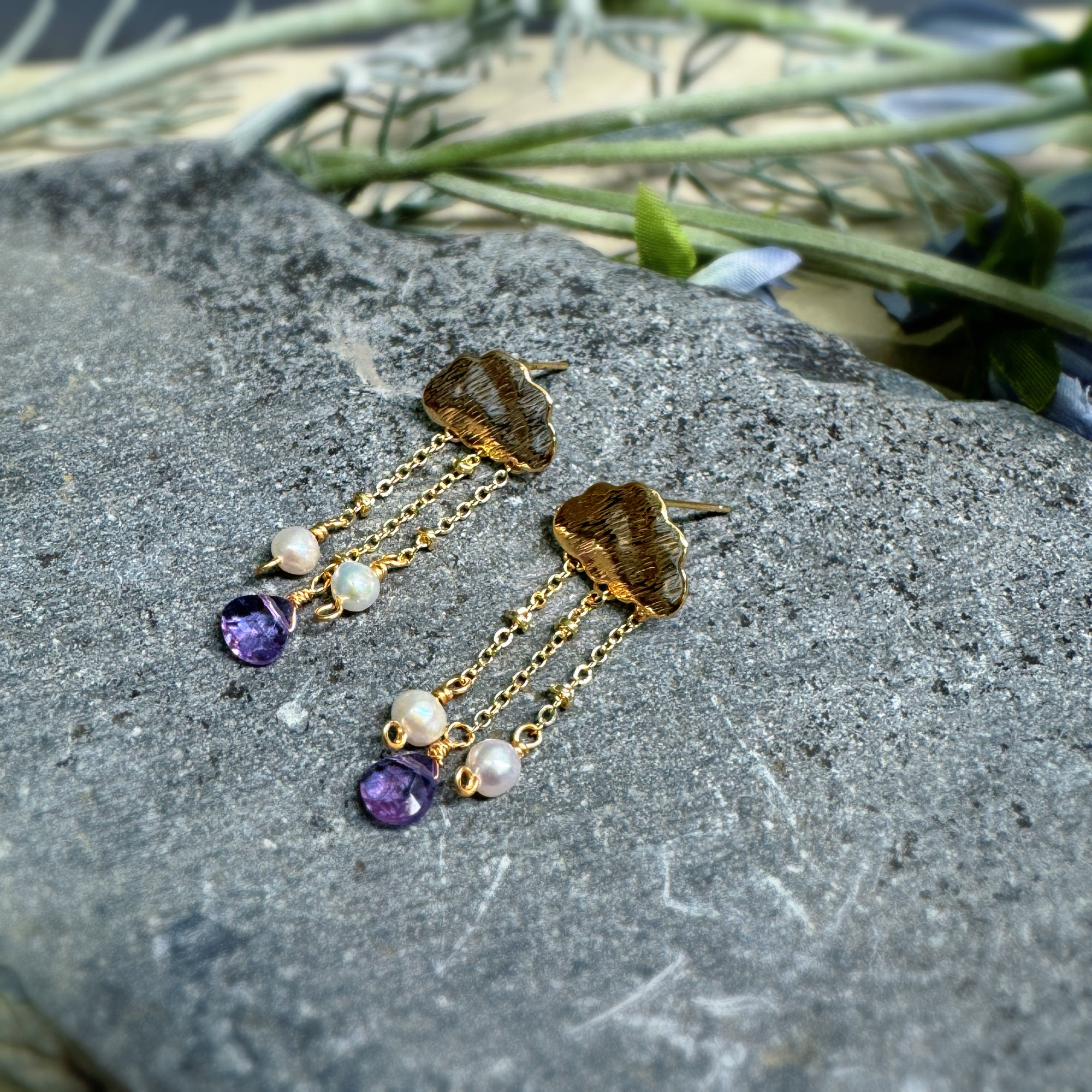 Gold cloud pearl and amethyst tassel earrings in natural light