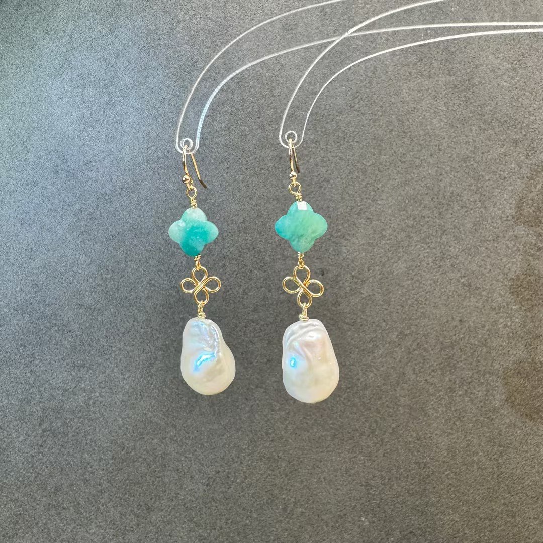 Teal clover stone and baroque pearl drop earrings close-up