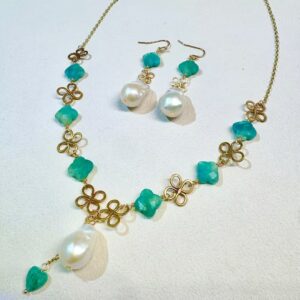 Baroque pearl and gold clover jewelry set - necklace and earrings flat lay