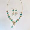 Baroque pearl clover necklace and earrings set, warm tone flat lay