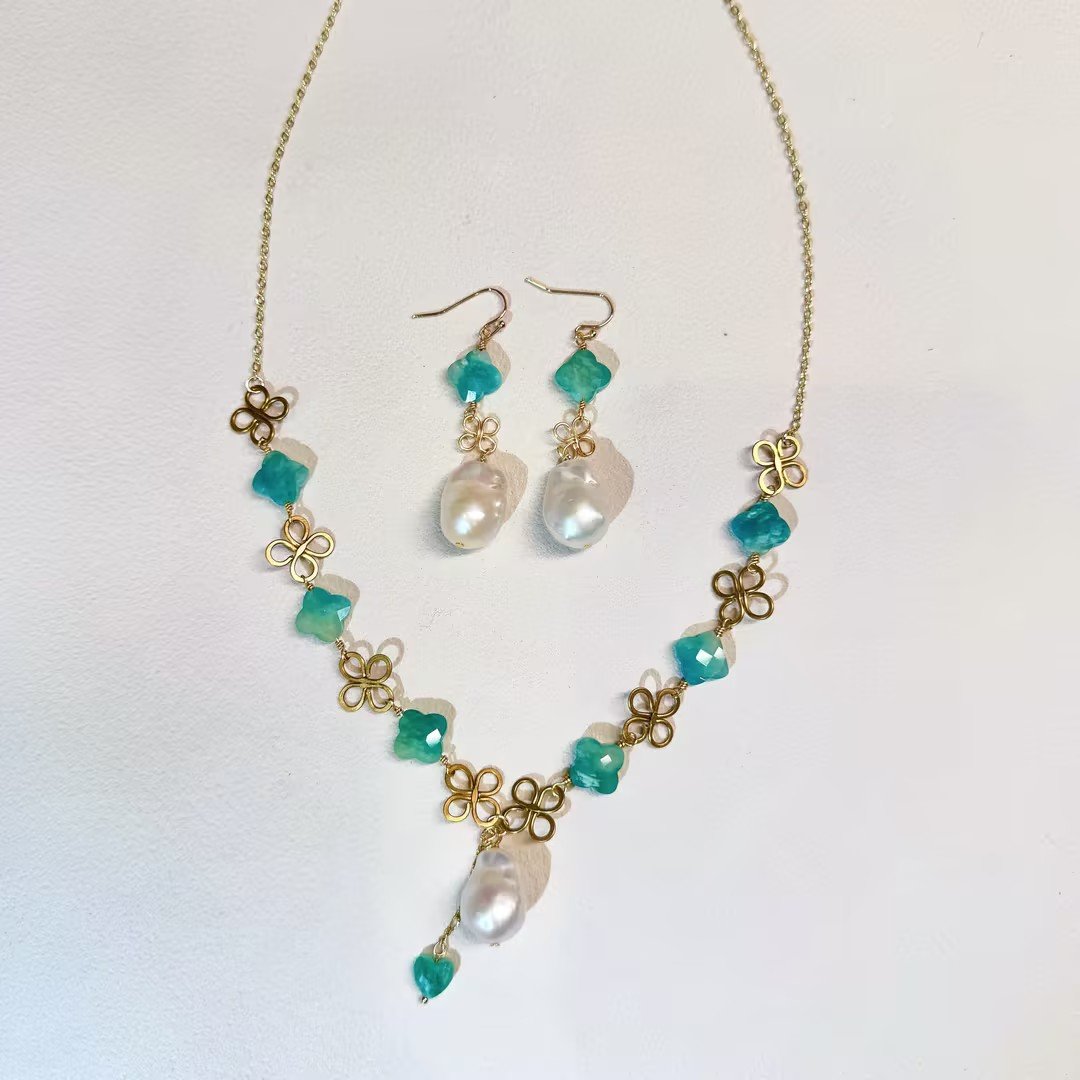 Baroque pearl clover necklace and earrings set, warm tone flat lay