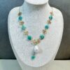 Baroque pearl clover necklace on jewelry display bust